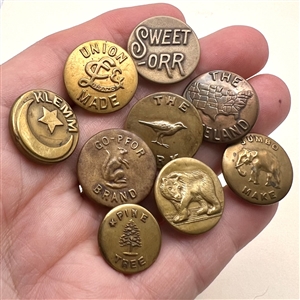 Nine assorted work clothes buttons. 
