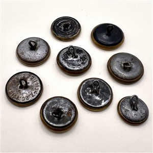 Nine assorted work clothes buttons. 