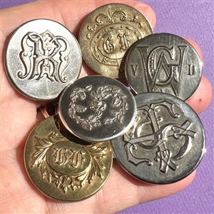 Six Livery and other monogram buttons.