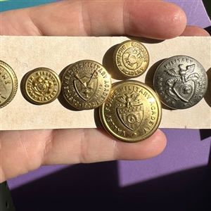 Twenty two U.S. and foreign assorted uniform buttons. 