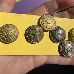 Twenty two U.S. and foreign assorted uniform buttons. 