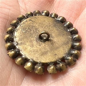 A 19th c. Transfer on porcelain button of cherub.