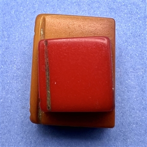 Bakelite realistic stacked books button.