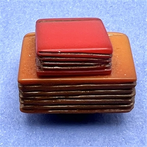Bakelite realistic stacked books button.