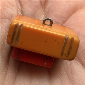 Bakelite realistic stacked books button.