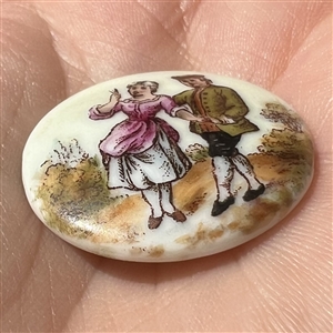 Ceramic button of courting couple.