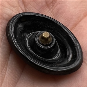 Oval imitation fabric black glass button.