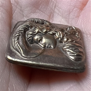 Brass button of Lillian Russell.