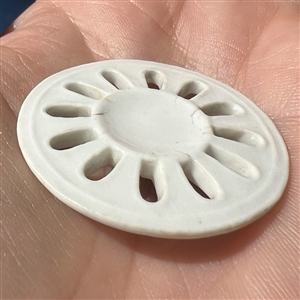 An 18th c. Royal Copenhagen pierced porcelain button.