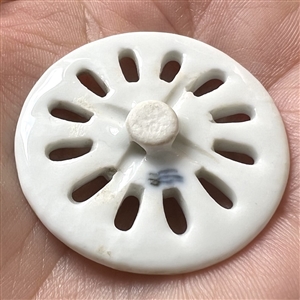 An 18th c. Royal Copenhagen pierced porcelain button.