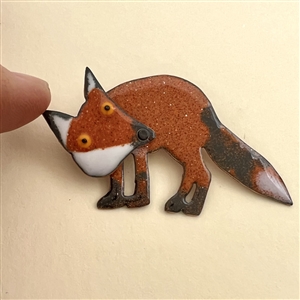 “Cascade Red Fox” enamel on copper studio button by Janet White.