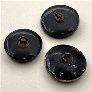 Three black glass buttons of animals.