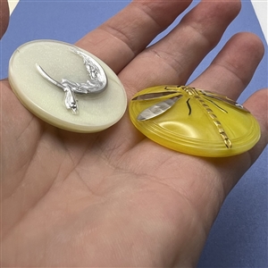 Two Czech glass buttons.