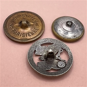 Three metal buttons of butterflies.