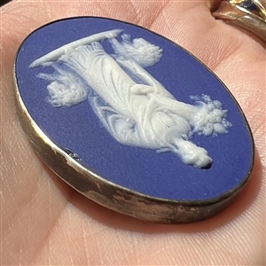 Oval Wedgwood button of a goddess holding a cornucopia.