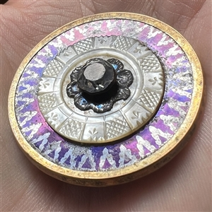 An 18th c. button of tinted steel with pearl, tinted steel flower and paste center.