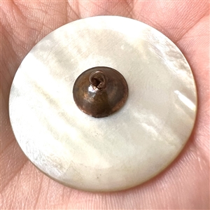 An 18th c. carved mother of pearl button with faceted paste center.