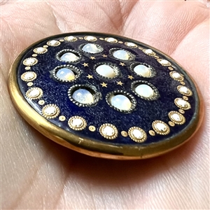 An 18th c. enamel with opaline glass set in metal button.