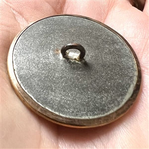 An 18th c. enamel with opaline glass set in metal button.