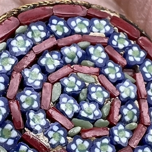 Italian mosaic target of flowers button.
