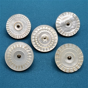 Five thick Colonial pearl buttons.