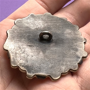 Lovebirds, carved natural material prong set in silver button. 