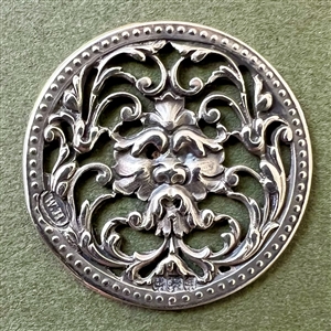 Hallmarked silver button of greenman.
