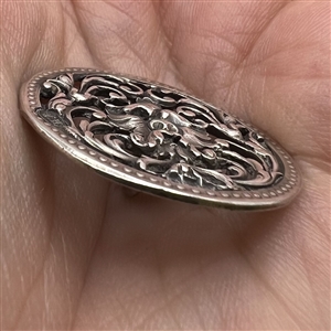 Hallmarked silver button of greenman.
