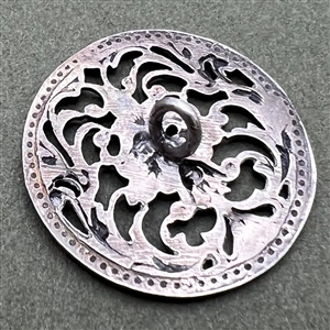Hallmarked silver button of greenman.