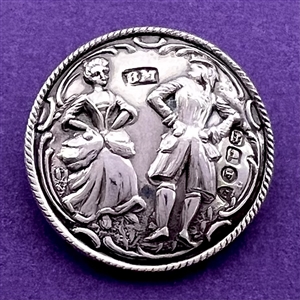 Hallmarked silver button of a couple dancing.