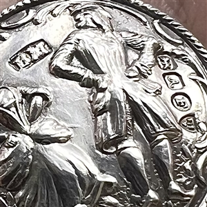 Hallmarked silver button of a couple dancing.