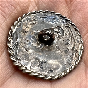 Hallmarked silver button of a girl picking fruit.