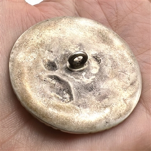 Large Continental silver button of a man courting a woman.