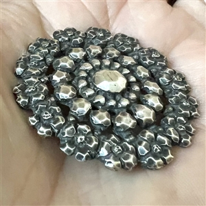 Silver button imitating “Court Steel.”