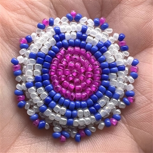 Two Native American buttons, beaded and silver.