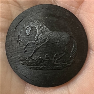 Two buttons of molded horn. The verbal is an Irish Repeal button from the mid 1800s.