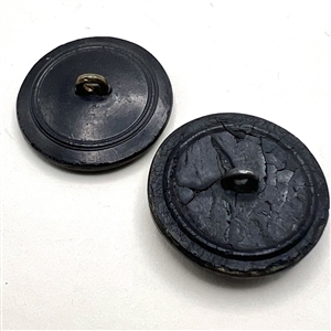 Two buttons of molded horn. The verbal is an Irish Repeal button from the mid 1800s.