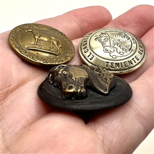 Three sporting buttons of horses.