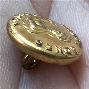 Rare “Widow Jones” brass work clothes button. 