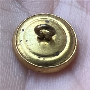 Rare “Widow Jones” brass work clothes button. 