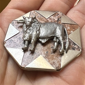 Faux handkerchief corner studio button of a cow by Phil Linley.