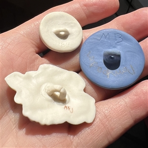 Three assorted Jasperware studio buttons.