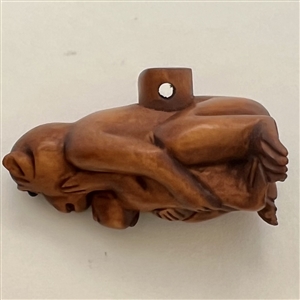Boxwood button of mother and baby monkey. 