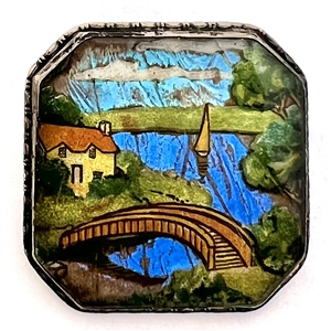Reverse painted lake scene with bridge and sail boat with real butterfly wing background button.