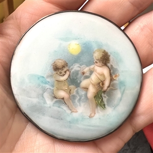 Extra large porcelain button of cherubs.