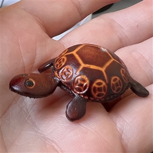 Leather realistic turtle button.