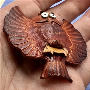 Owl with mouse in talons leather button.