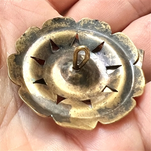 Brass button with two horse heads escutcheon.