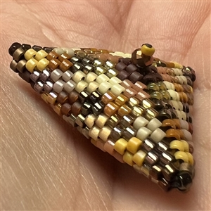 Unique beaded studio button by Lili Cantelmi.