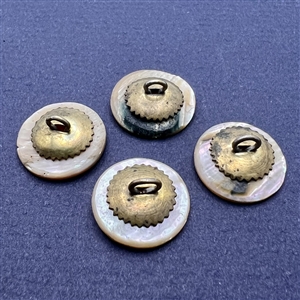 Four shell sporting buttons with escutcheons.